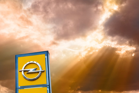 AUGSBURG, GERMANY â JUNE 16, 2022: Advertising sign of the car brand OPEL in front of a sky with cloudsのeditorial素材