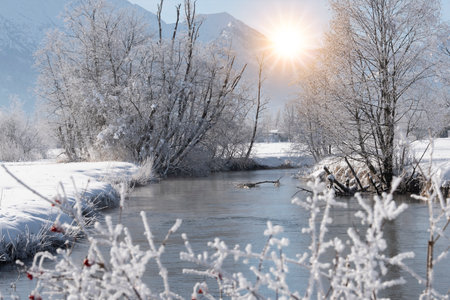landscape in winter with mountain range and riverの写真素材