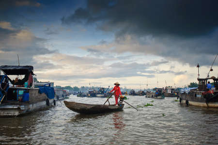 CAN THO,VIETNAM-APRIL 14, 2012: Cai Rang Floating Market, 6km from Can Tho, most famous and biggest floating market in Mekong Delta with hundreds of boats packed in Can Tho, Vietnam.のeditorial素材