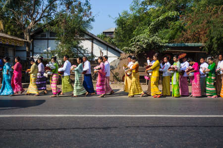 Mandalay, Myanmar-JANUARY 6: Parade of local Burmese by dressing with traditional costume. The usual activity for wedding ceremony on January 6, 2014のeditorial素材