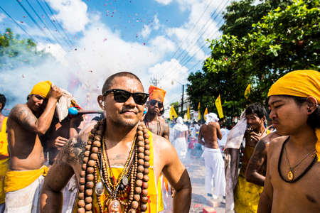 Phuket, Thailand - October 17, 2015: Parade of devotees along old town street of Phuket town in vegetarian festival.のeditorial素材