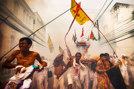 Phuket, Thailand - October 18, 2015: Parade of devotees along old town street of Phuket town in vegetarian festival.のeditorial素材