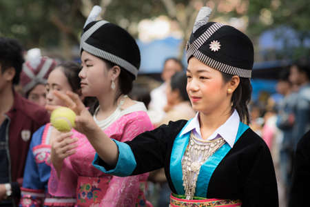 A woman of local mountaineer tribe 'Hmong' is dressing with traditional costume in Luang Prabang, Laos.のeditorial素材