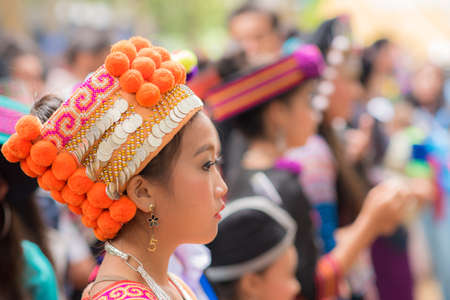 Woman of local mountaineer tribe 'Hmong' is dressing with traditional costume in Luang Prabang,...