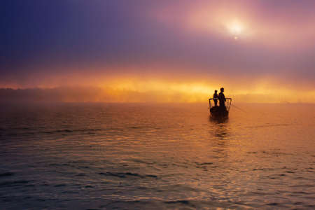 Fishing in the mist, Thailandの写真素材