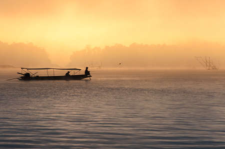 Fishing in the mist, Thailandの写真素材