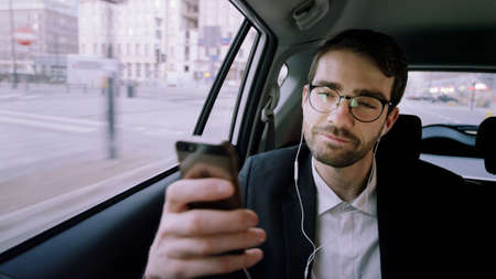 Young Businessman Looking Around During a Phone Call