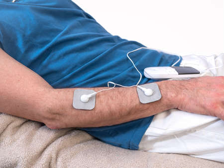 Close-up Of Person With Electrodes On Shoulder