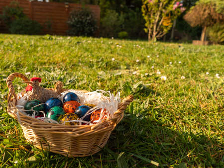 Easter. Painted eggs in a basket on green grass