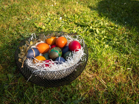 Easter. Painted eggs in a basket on green grass