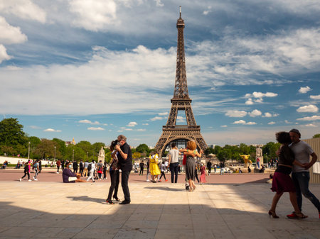 Paris, France, May 2021. Dancing Argentine couples tango on the Tracadero square in the background the Eiffel Tower symbol of Paris, the city of loveのeditorial素材