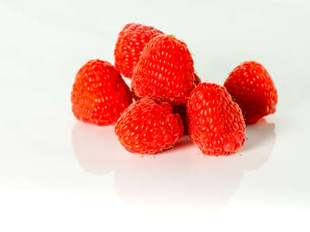 Ripe raspberries isolated on white background cutout