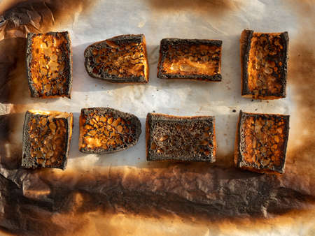 burnt baguette - top view, black burnt bread crusts, baguettesの写真素材