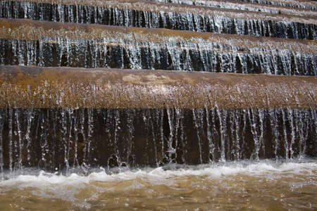 falling water in the fountain macro backgroundの写真素材