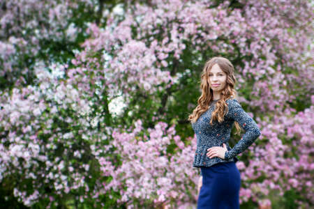 The beautiful girl in wonder wood in a color dressの写真素材