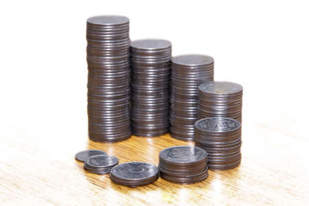 Stacks of coins standing in a circle, economic backgroundの写真素材