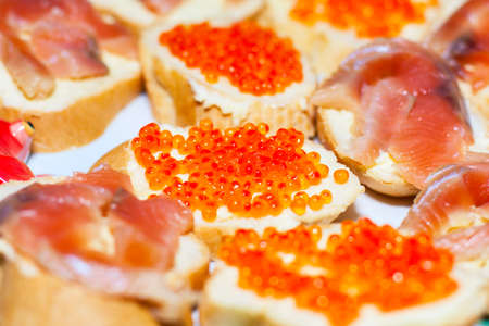 Sandwiches with red fish caviar food backgroundの写真素材