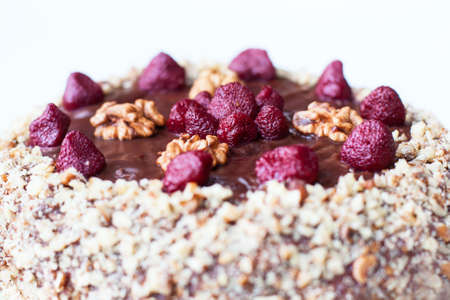 Homemade chocolate cake with strawberries and walnutsの写真素材