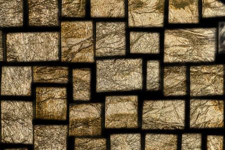 mosaic glass pieces with gold leaf art backgroundの写真素材