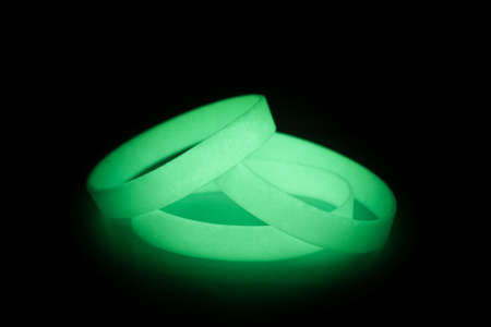 Colored latex glowing light-bracket bracelet on Black Background