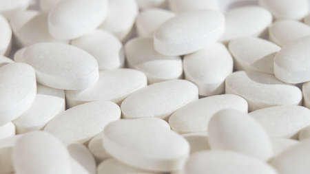 Close-up of perfectly white tablets in a white space. A very beautiful bright drawing light, a...
