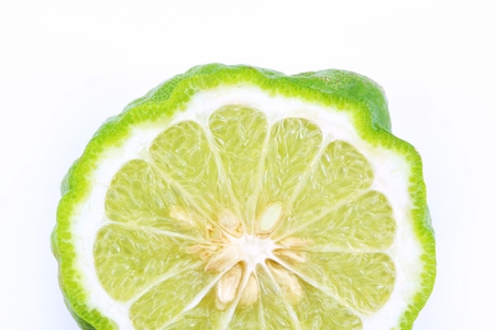 Close up of Kaffir lime and leaves on white background. Tropical fruits for healthy concept, shooting in studio.の写真素材