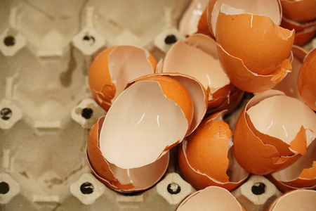 Close up eggshell on paper block, shoot in studio. Chef hitting egg for cooking food in the kitchen....