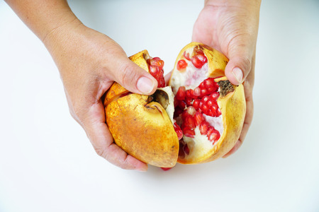 Close up of Pomegranate seeds on white background. Selective focus and free space for text. Healthy fruits concept.の写真素材