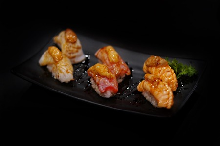 Japanese food: Mix sashimi and ebi served with Japanese cooked rice on table. Clean food concept. Toned image. Selective focus and free space for text.の写真素材