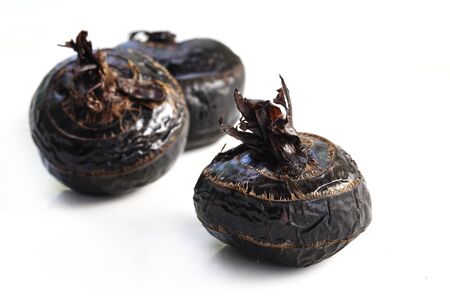 Boiled Truffles or boiled Chinese water chestnut on white background, Selective focus and free space for text. Shooting in studio for advertising.の写真素材