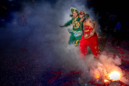 CHONBURI, THAILAND - SEPTEMBER 30, 2019: At night, The parade possessed by his god walking on fire...