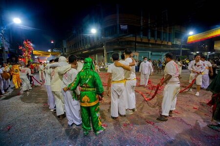 CHONBURI, THAILAND - SEPTEMBER 30, 2019: At night, The parade possessed by his god walking on fire in Vegetarian Festival also known as Nine Emperor Gods Festival. Stop action and motion blur.のeditorial素材