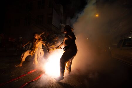 CHONBURI, THAILAND - SEPTEMBER 30, 2019: At night, The parade possessed by his god walking on fire in Vegetarian Festival also known as Nine Emperor Gods Festival. Stop action and motion blur.のeditorial素材
