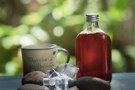 Cold brew coffee in glass bottle on the table