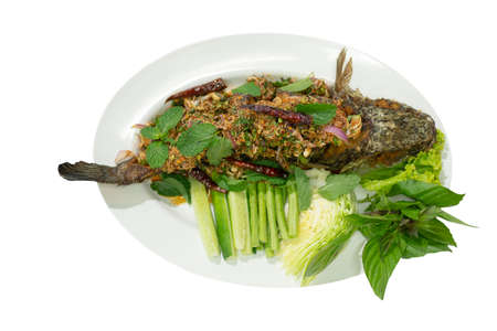 Larb plachon is fried snake-head fish topping with chili and spicy herbs. Served with...