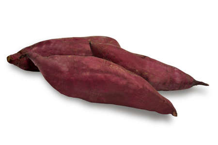 Japanese sweet potatoes or Beni Haruka in bamboo basket isolated on white background. This image stacked   for food advertisement ideas concept.の写真素材
