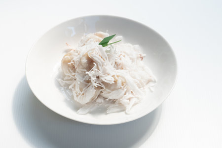 Tradition Thai dessert, Local name Kanom Tom, boiled rice flour dumpling coated with shedded coconut...
