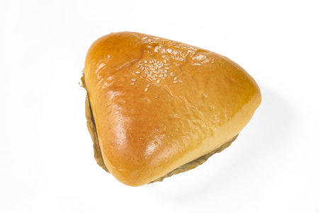 baked hamburger bun on a white background in close-upの写真素材