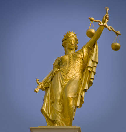 Lady of Justice statue in gold in Bruges Flanders