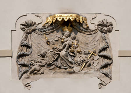 Fresco on a Prague facade depicting Madonna with Child serving justice.の写真素材