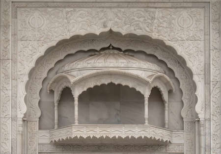 Outside balcony carved in white marble at New Delhi's Sikh temple.の写真素材