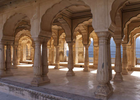Gallery of rimmed pillars in light sunshine at Jaipur's Amber Fort.のeditorial素材
