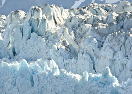 Sun paints azure blue shine in ice cones.の写真素材