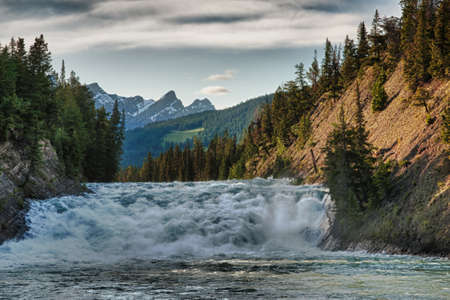 Play of water, light and clouds forming over the Rocky Mountains.の写真素材