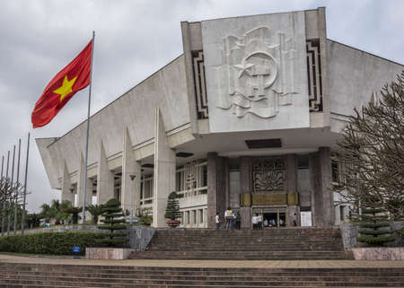 Vietnam Hanoi - March 2012: Entrance to Ho Chi Minh museum with flag.のeditorial素材