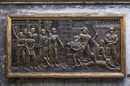 Vietnam Hanoi - March 2012: Mural in Hoa Lo Prison depicting brutal treatment by French....