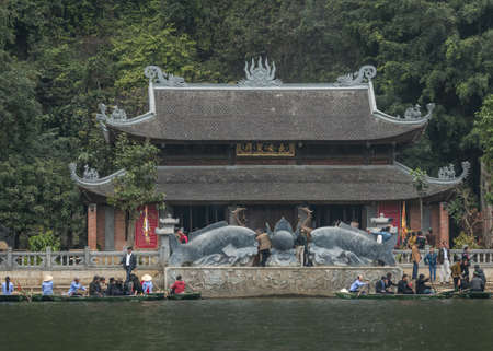 Vietnam Ninh Binh - March 14, 2012: Pagoda on Tam Coc lake to be reached by rowboat only.のeditorial素材