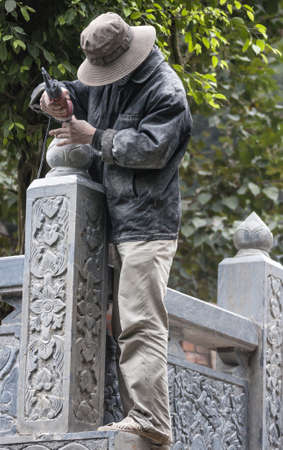 Vietnam Ninh Binh - March 14, 2012: Sculpting stone fence at Pagoda.のeditorial素材