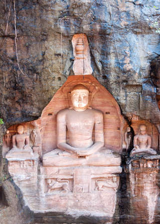 Pink sandstones contrast with wet rough dark rock.の写真素材