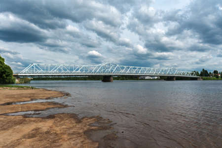 Menacing skies over the metal bridge linking the city with the rest of Lapland.の写真素材
